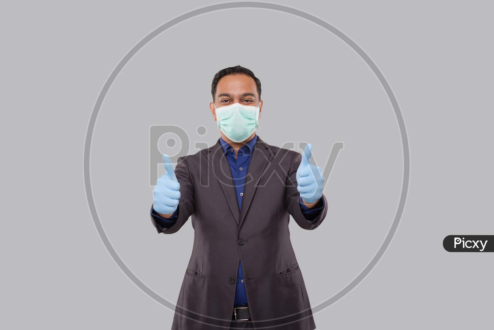 Businessman Showing Thump Up Both Hands Wearing Medical Mask And Gloves Isolated. Indian Business Man Standing Thump Up Sign