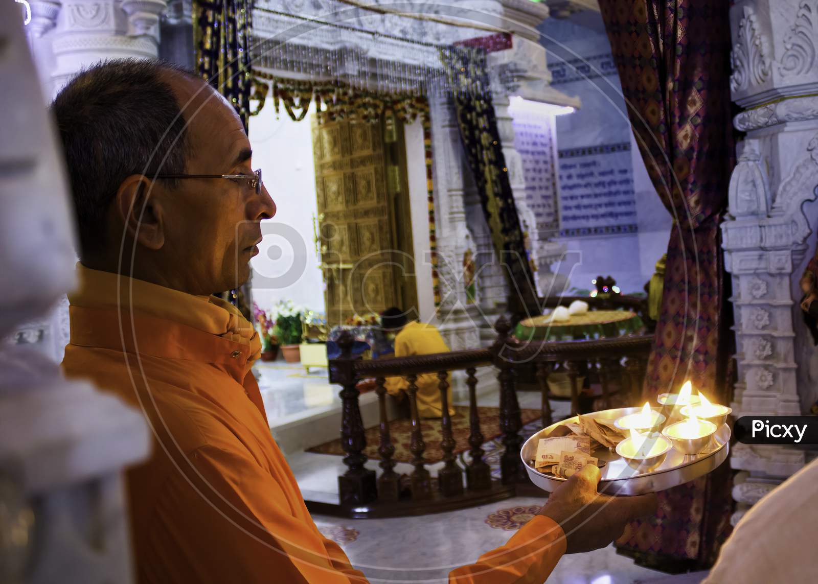 Mathura, India - April 11, 2014: Interior Of Prem Mandir (Love Temple) A Hindu Temple In Vrindavan. A Priest ( Pandit ) Can Be Seen Praying And Performing Rituals.