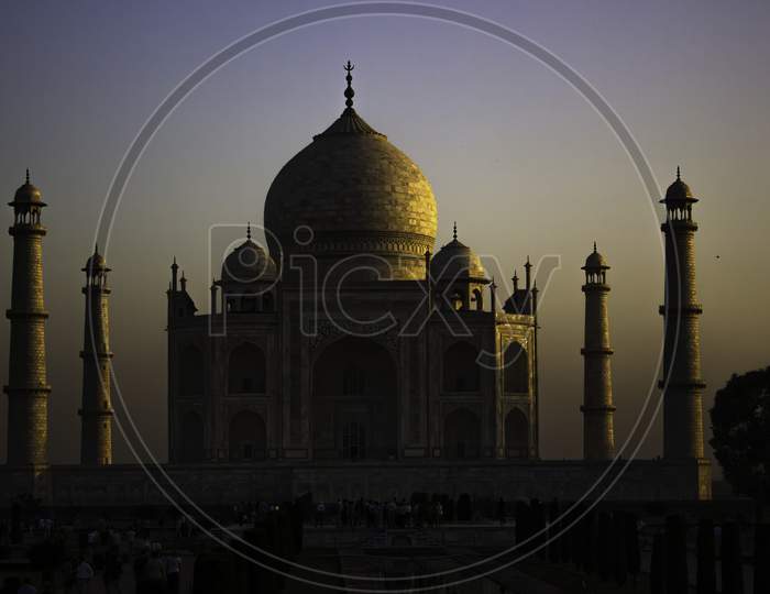 Agra, India - April 10,2014: Close Up Of Tajmahal, One Of The Seven Wonder Partially Lit Under Dramatic Sunrise