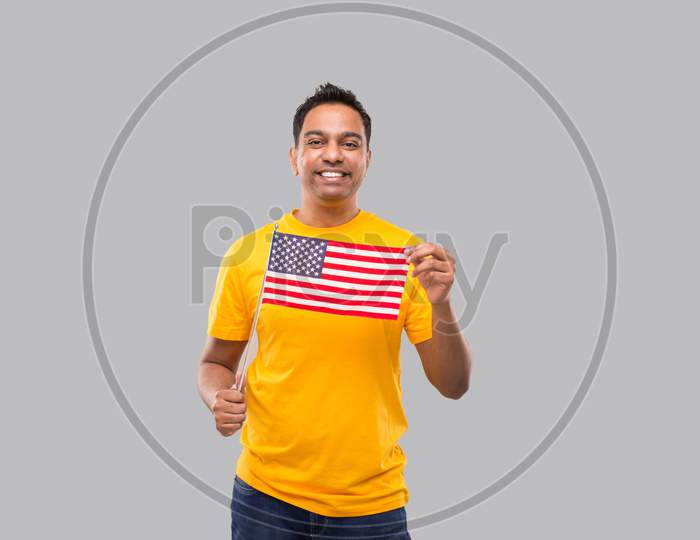Indian Man Usa Flag In Hands Isolated. Indian With American Flag