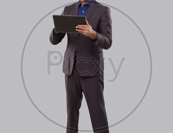 Businessman Using Tablet Isolated. Indian Business Man Standing Full Length With Tablet In Hands