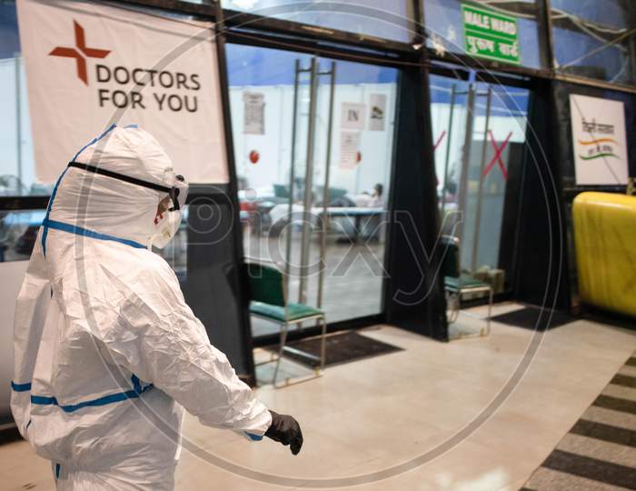 A doctor wearing a PPE suit takes round at the Common Wealth Games stadium which has been converted into a Coronavirus Care Centre in New Delhi on July 17, 2020