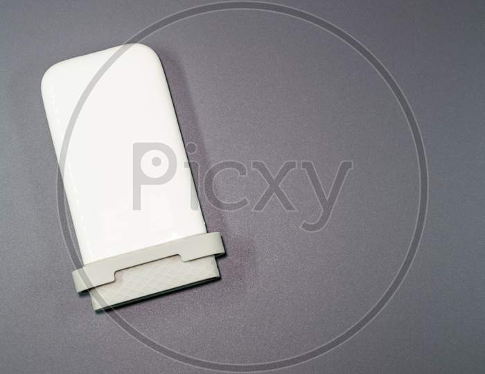 An Isolated View Of A Power Bank In A Gray Background