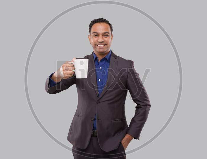 Businessman Holding Coffee Cup. Indian Businessman In Suit With Coffee Cup
