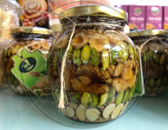 Salted Nuts And Dry Fruits In A Glass Jar