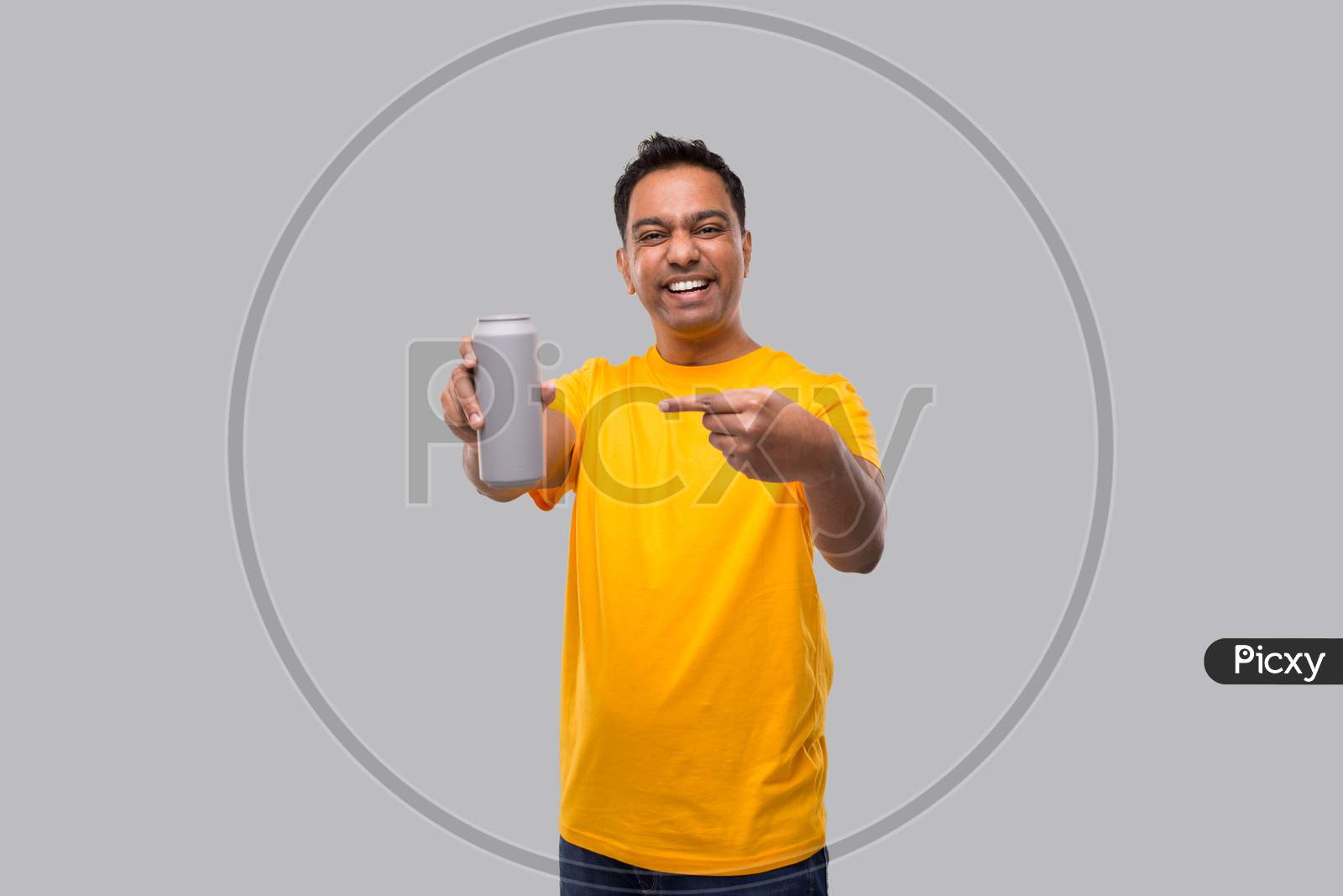 Indian Man Pointing At Tin Can Isolated. Drink