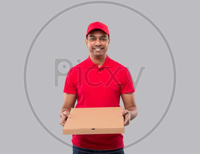 Delivery Man Pizza Box In Hands Isolated. Red Tshirt Indian Delivery Boy.