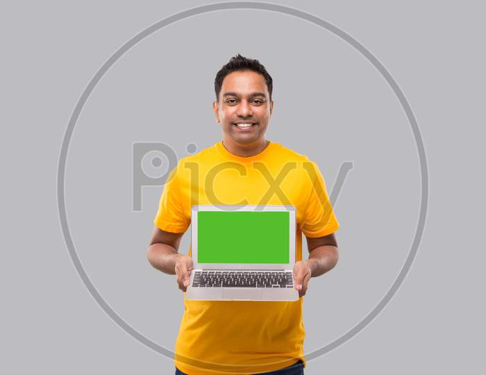 Delivery Man Showing Laptop Green Screen. Home Orders, Quarantine Delivery, Shopping Online, Freelance Worker Concept.