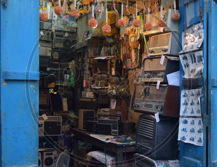 In India a radio mechanic store that stores vintage radios and musical parts.