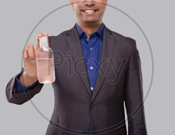 Businessman Showing Hands Sanitizer Isolated Close Up. Business Man Holding Hand Antiseptic