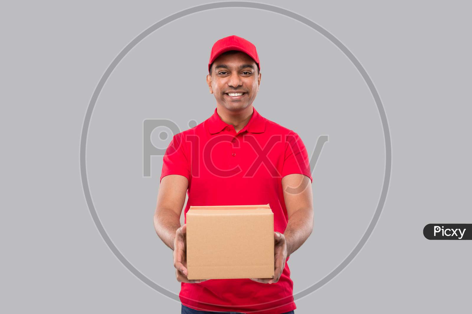 Delivery Man Box In Hands Isolated. Red Tshirt Indian Delivery Boy. Home Delivery. Quarantine Hero.