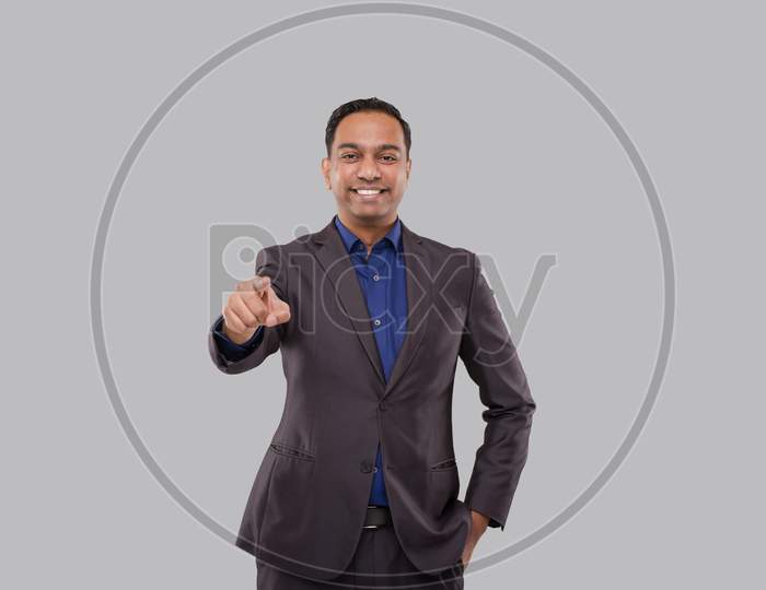 Businessman Pointing Front Watching In Camera Isolated. Indian Business Man Standing