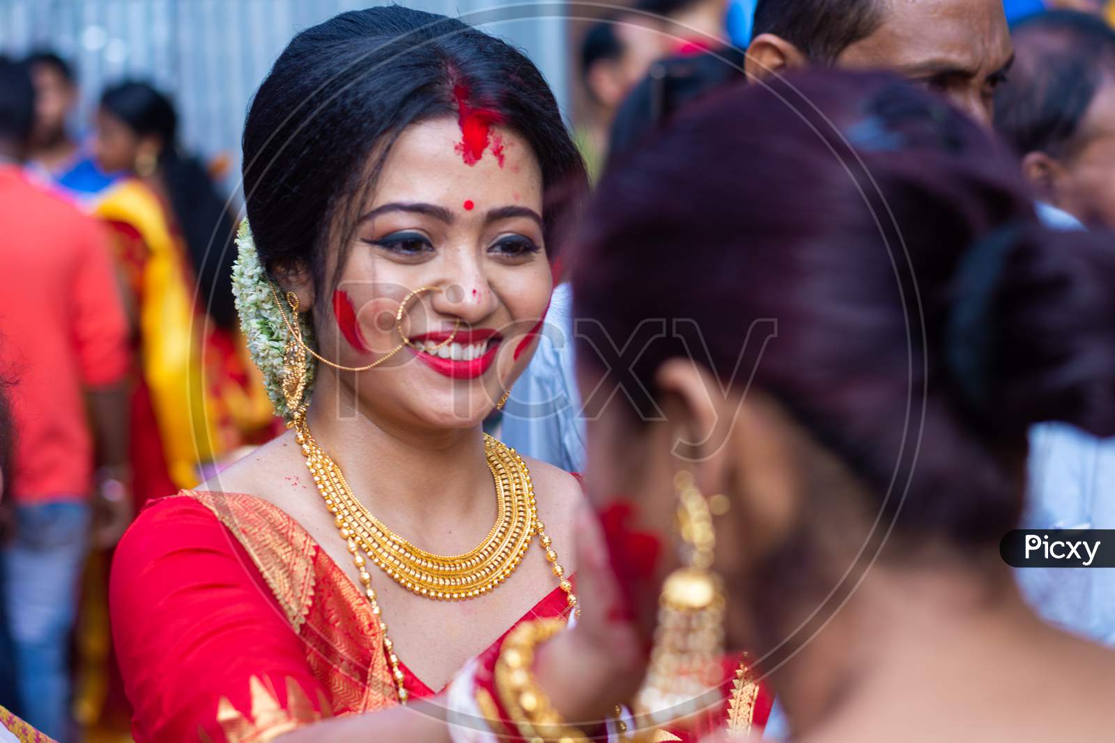 Holi and Durga puja Festival in India. Portrait of an unidentified Bengali woman playing with vermilion or colors on vijay dashami at the Durga puja festival in Kolkata on 8th October 2019.