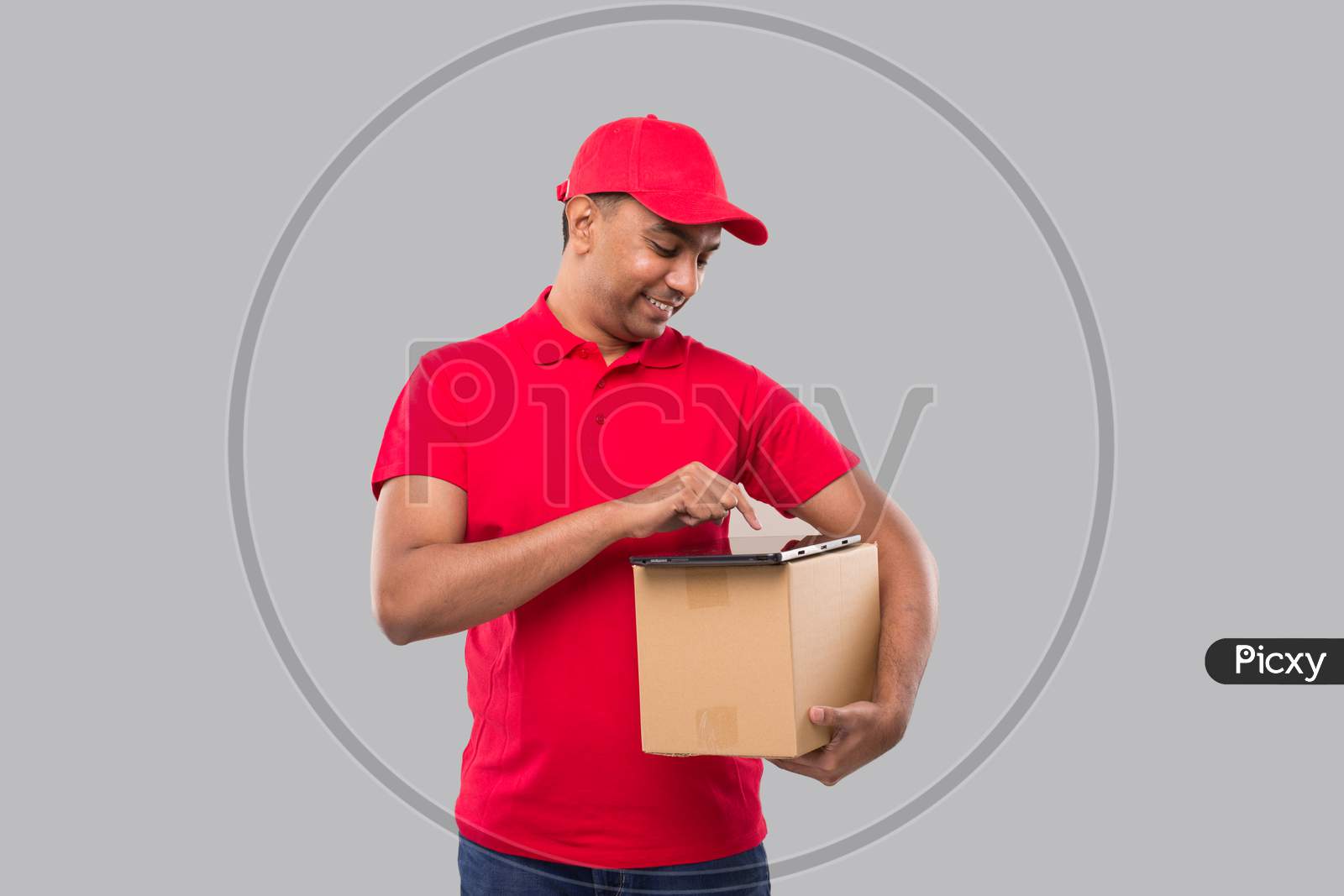 Delivery Man Using Tablet Holding Box. Indian Delivery Boy Tablet. Home Delivery Technology