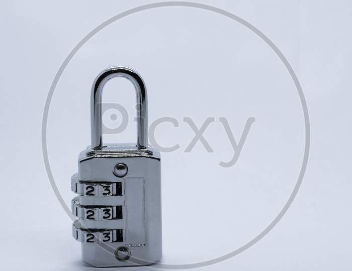 A Lock On A Plain White Background. Selective Focus, Selective Focus On Subject, Background Blur