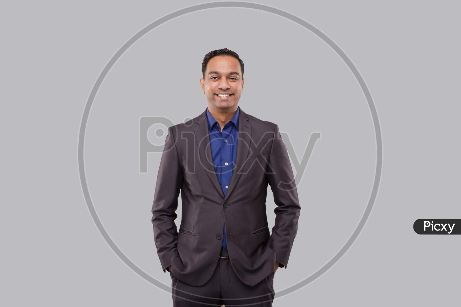 Businessman Hands In Pockets Isolated. Indian Man In Suit