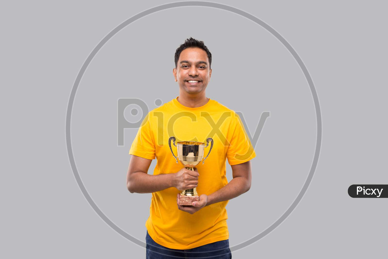 Indian Man Holding Trophy In Hands Isolated Smilling