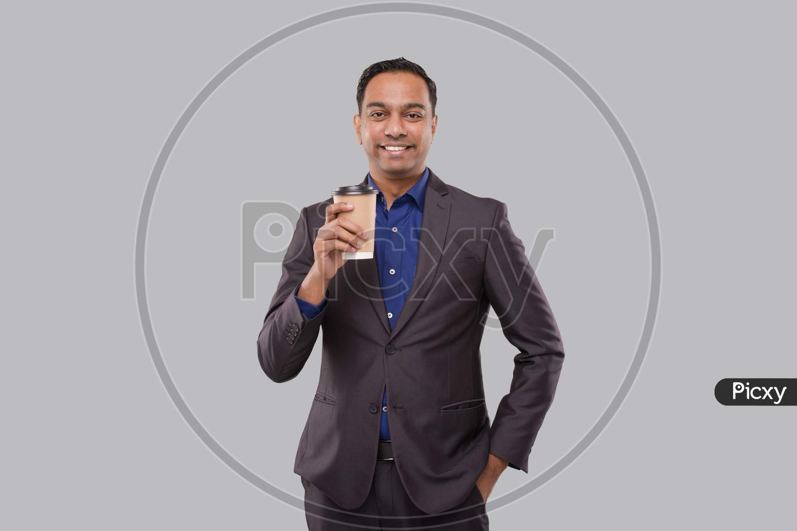Businessman Holding Coffee To Go Cup Isolated. Indian Business Man With Coffee Take Away Cup In Hands