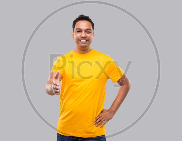 Indian Man Offering Hand To Shake. Greeting And Welcoming Gesture. Business Advertisement Concept. Hand Shake