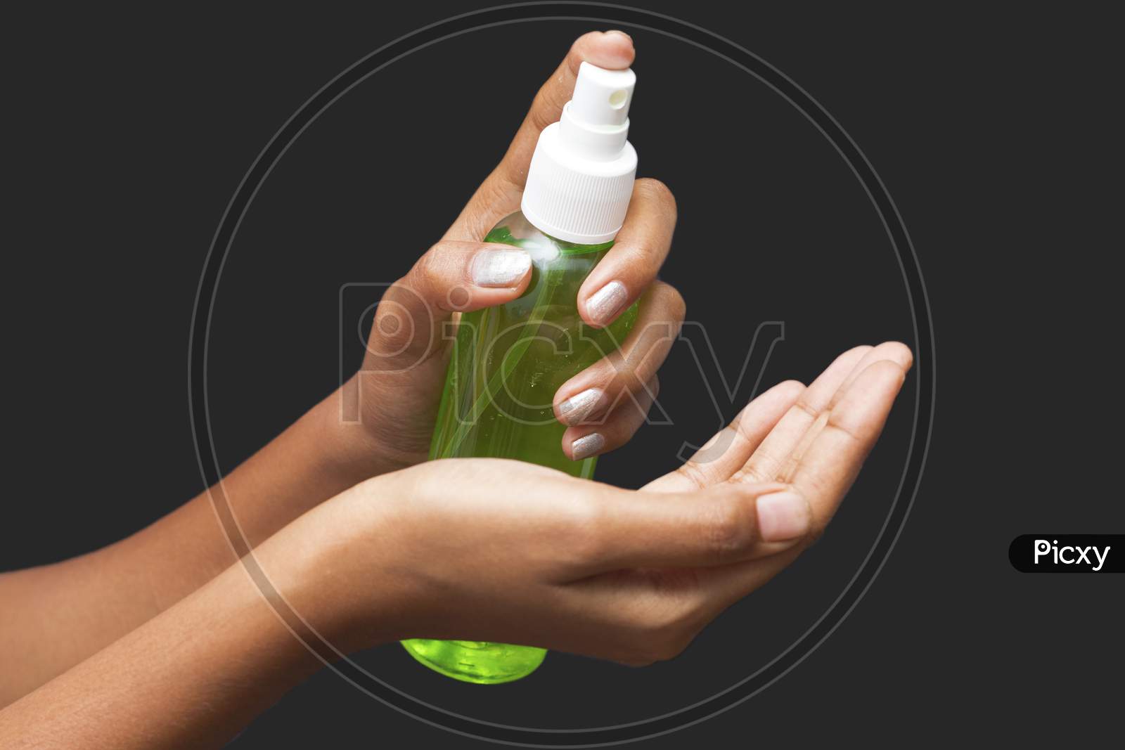 a lady sanitized her hands by alcohol hand sanitizer to avoid covid-19.