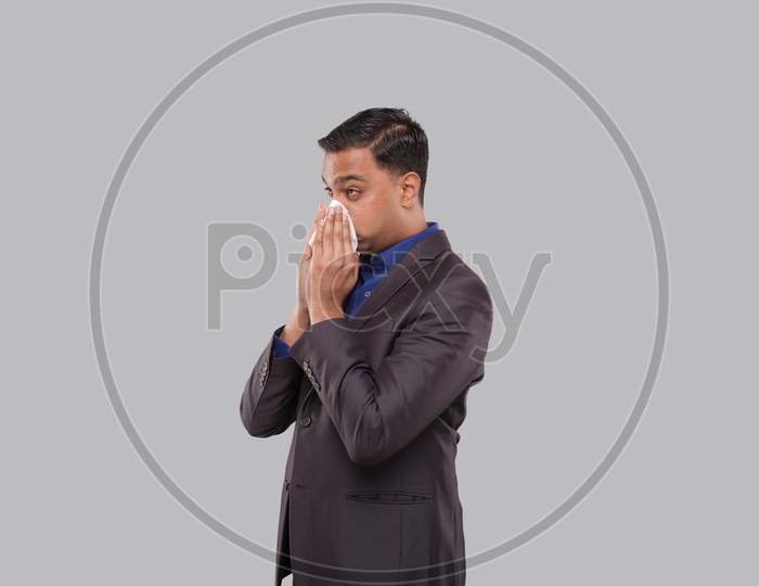 Businessman Sneezing. Indian Business Man Blowing Nose Isolated. Medicine, Healthy Life, Business, Virus Concept