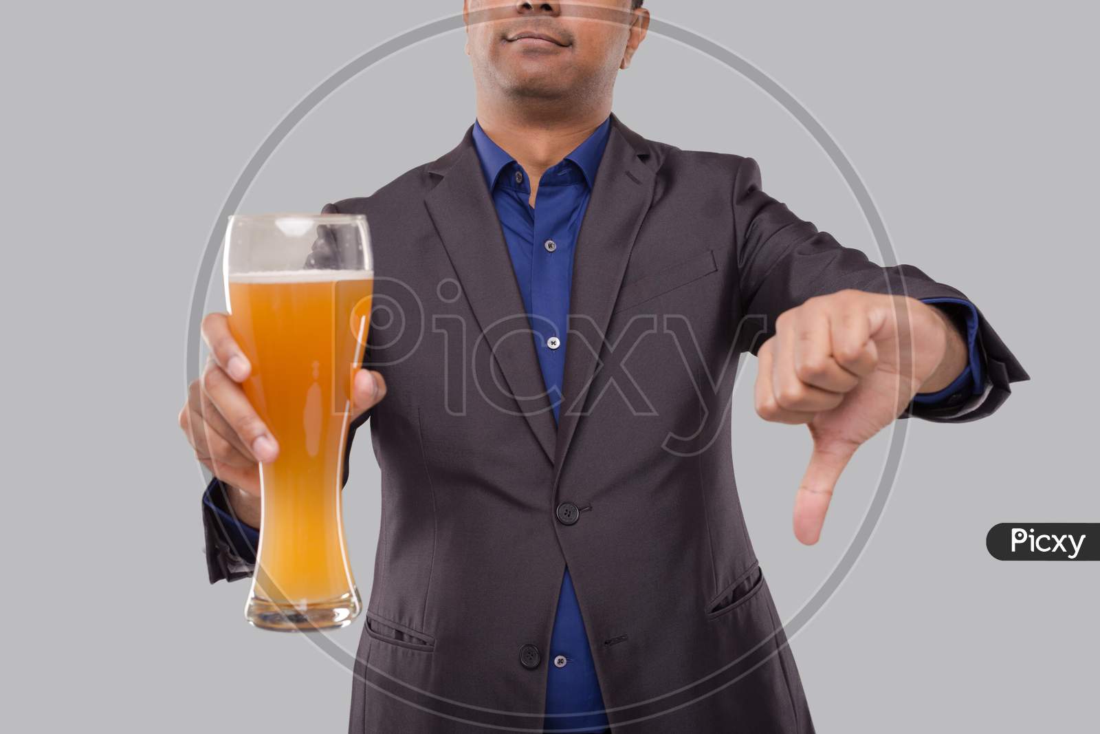 Businessman Showing Beer Glass And Thumb Down. Indian Business Man With Beer In Hand Close Up