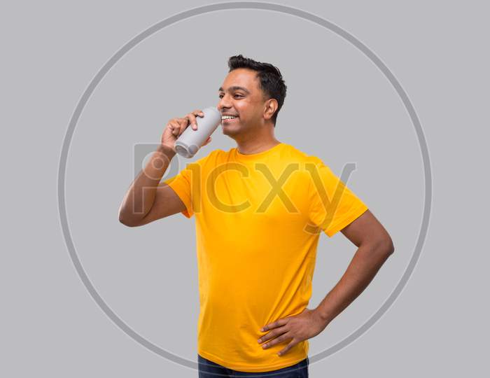 Indian Man Drinking From Tin Can Isolated.