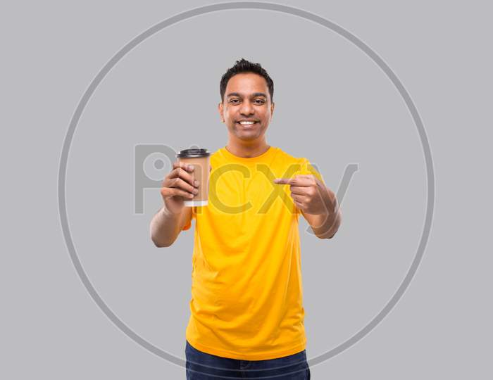 Indian Man Pointing At Coffee To Go Cup Isolated. Man Coffee Take Away Cup In Hands