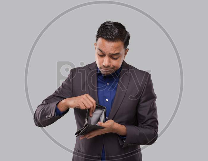 Businessman Holding Empty Wallet. Indian Business Man No Money, No Salary, No Cash Concept