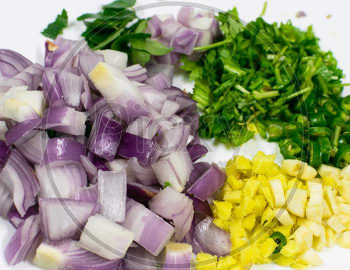 Chopped Mix Vegetables In A White Plate, Onion, Garlic, Ginger, Chilli, Coriander,