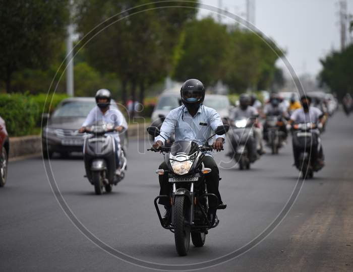 Motorists cover their faces with face masks, kerchief in Hyderabad.
