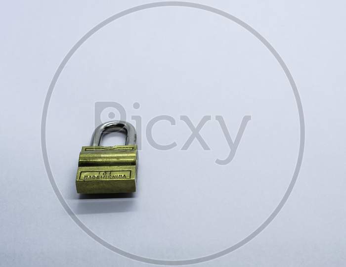 A Lock On A Plain White Background. Selective Focus, Selective Focus On Subject, Background Blur