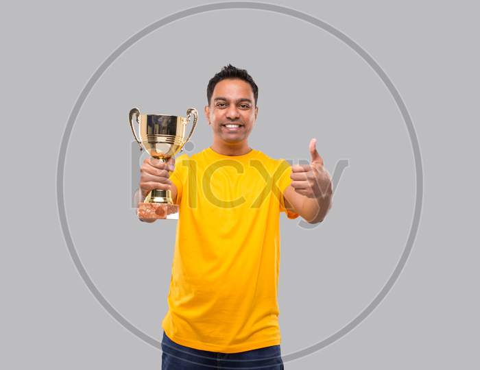 Indian Man Holding Trophy Showing Thumb Up Isolated Smilling