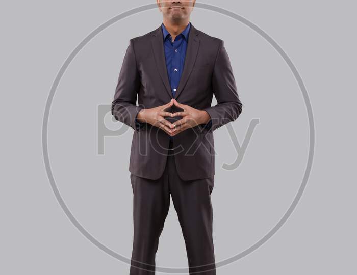 Businessman Smilling Hands In Front Of Chest Isolated. Indian Businessman Standing Full Length. Business Pose