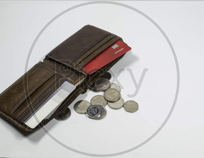 A Wallet And Uae Dirhams And Coins With White Background