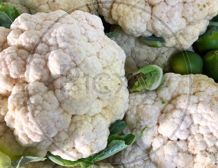 A Bunch Of Cauliflower In Vegetable Market