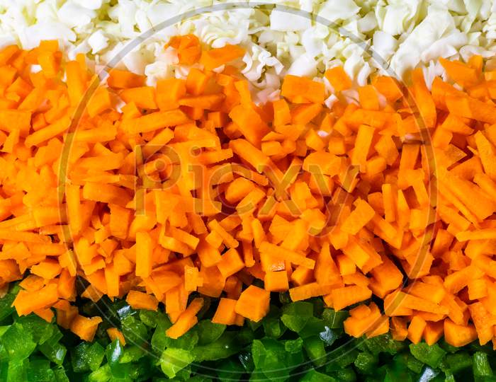 Chopped Cabbage, Carrot And Green Capsicum Nicely Arranged In Plate