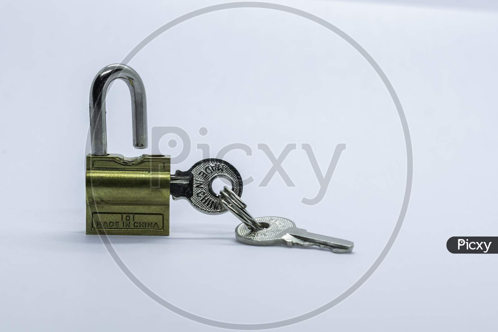 A Lock And Key On A Plain White Background.