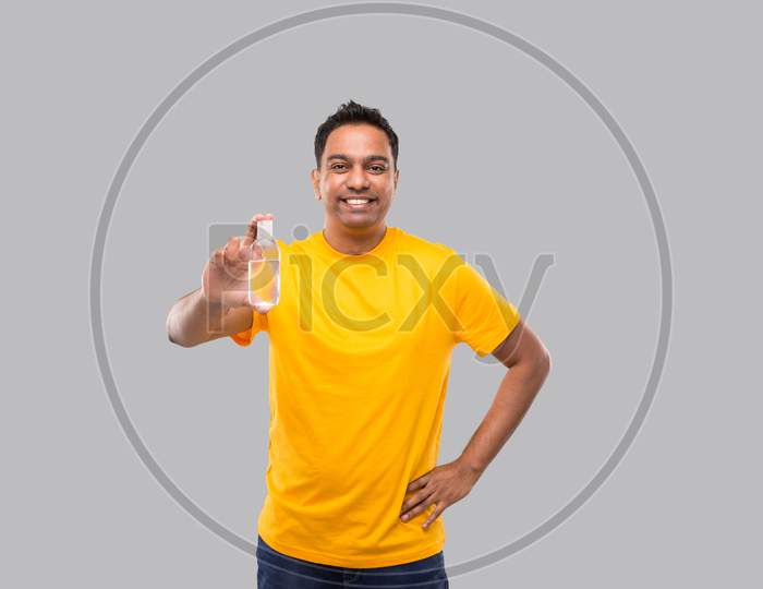 Indian Man Showing Hands Sanitizer Isolated. Indian Man Holding Hand Antiseptic