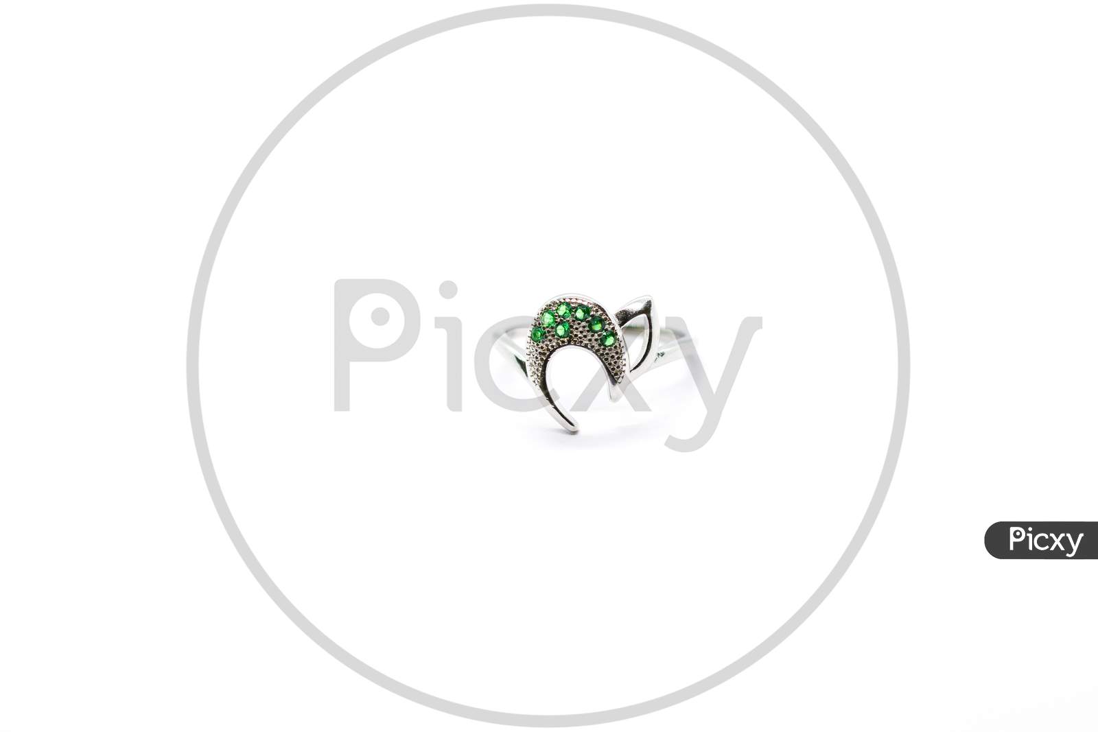 Silver Female Ring Design With Green Diamond