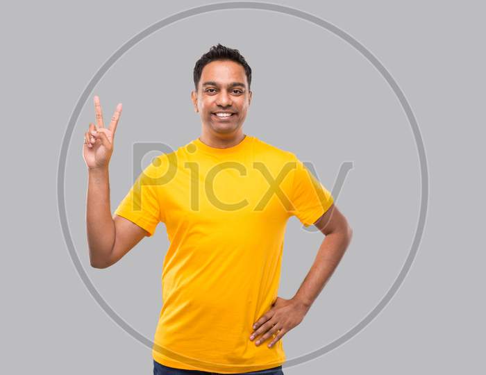 Indian Man Showing Peace Sign Isolated Smilling