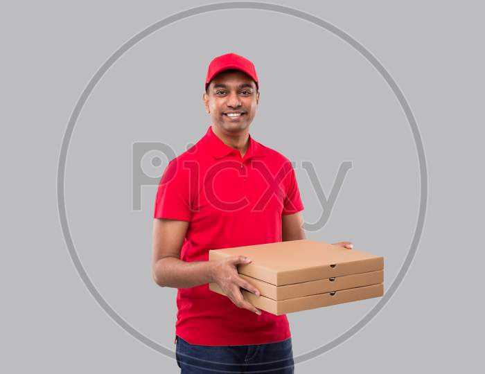 Delivery Man With Three Pizza Box In Hands Isolated. Red Tshirt Indian Delivery Boy.