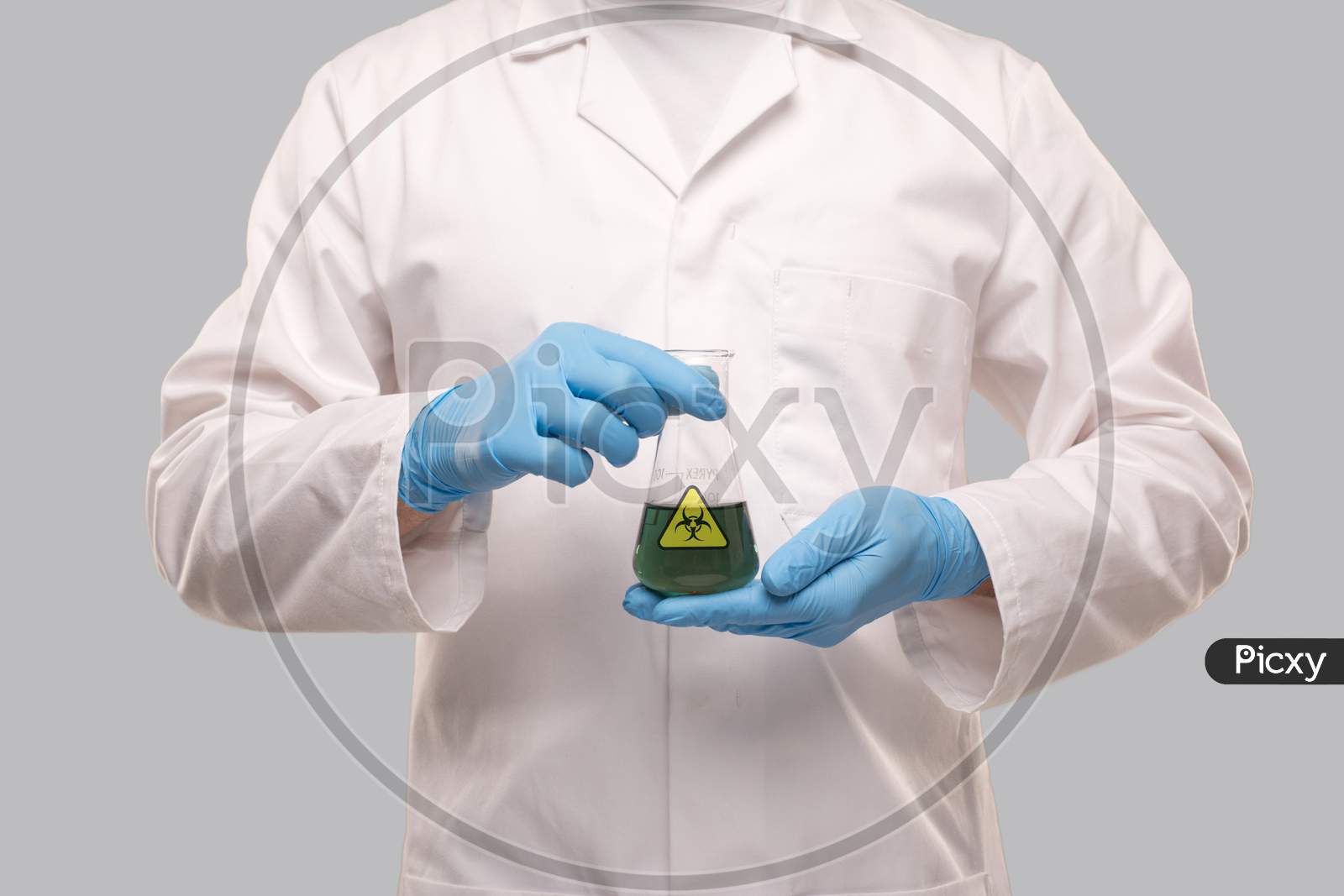 Male Doctor Wearing Gloves Showing Flask With Green Liquid Biohazard Sign. Science, Medical, Virus Concept