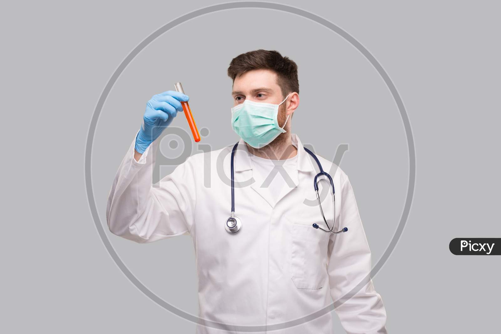 Male Doctor Checking Intently Analysis Wearing Medical Mask And Gloves. Portrait. Virus Analysis Concept