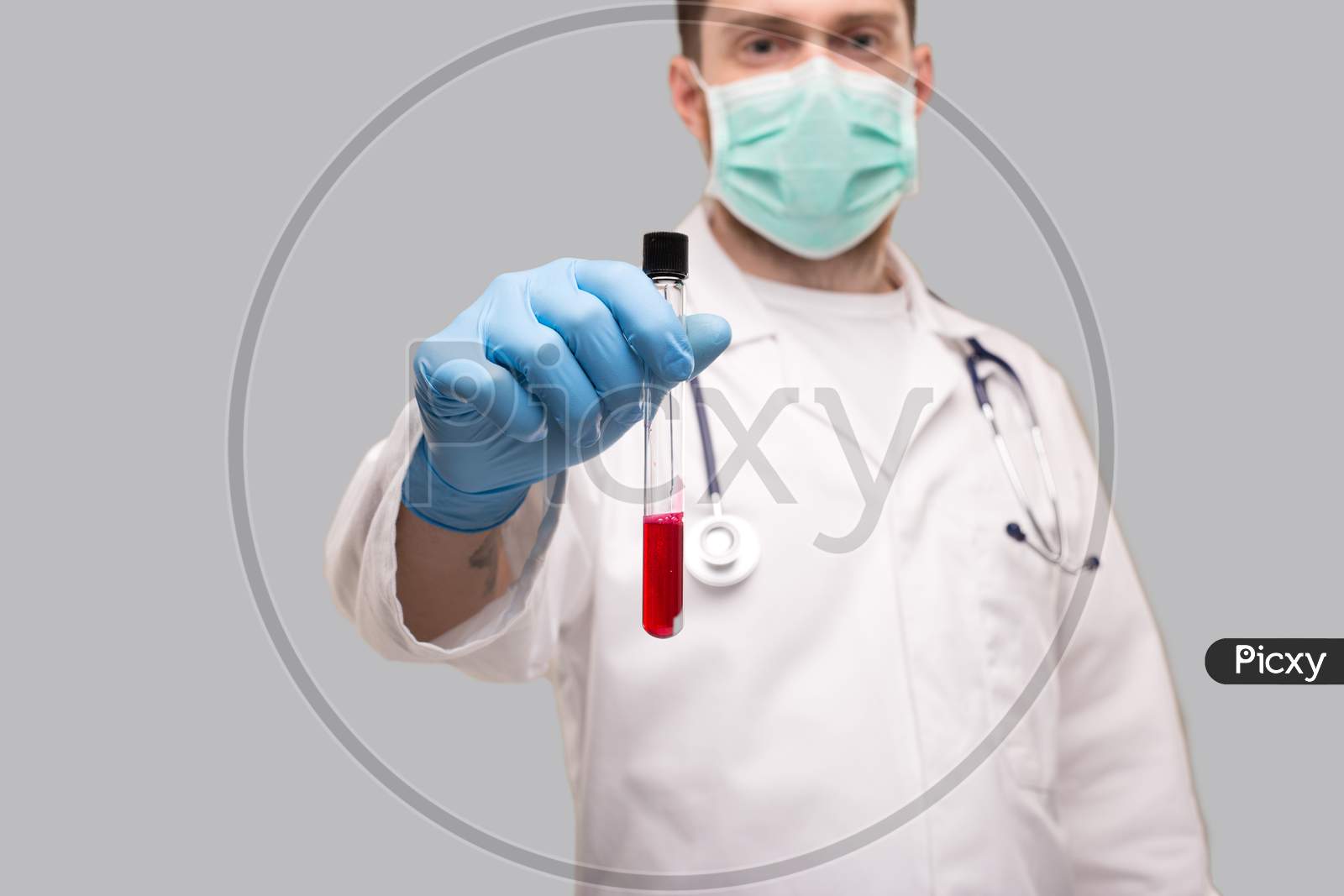 Doctor Showing Blood Analysis Wearing Gloves And Medical Mask. Blood Analysis Close Up.