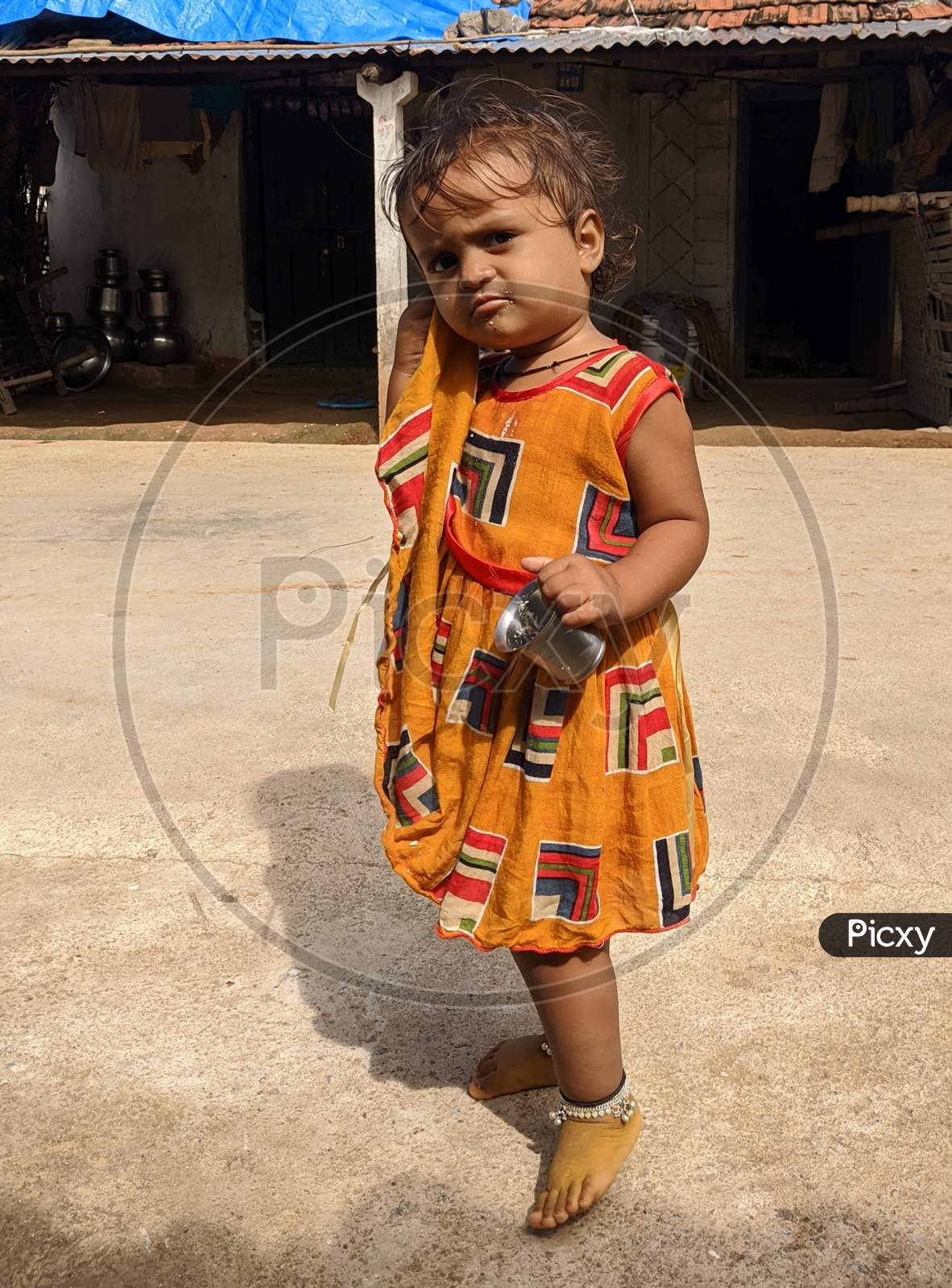 Image of Baby girl in rural area. Small baby girl from village ...