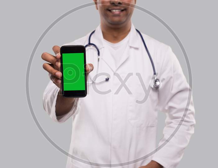 Doctor Holding Phone. Indian Man Doctor Technology Medicine At Home. Phone Green Screen Close Up Isolated