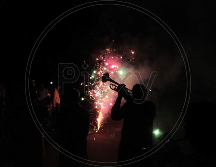 Fireworks in a festival people jumping in joy