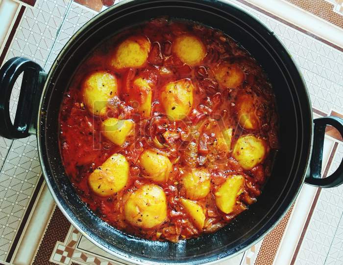Dum Aloo or Aloo dum, popular Indian dish. Spices and flavoured with chilli, garlic and fennel in smooth gravy which coat the fried potatoes.