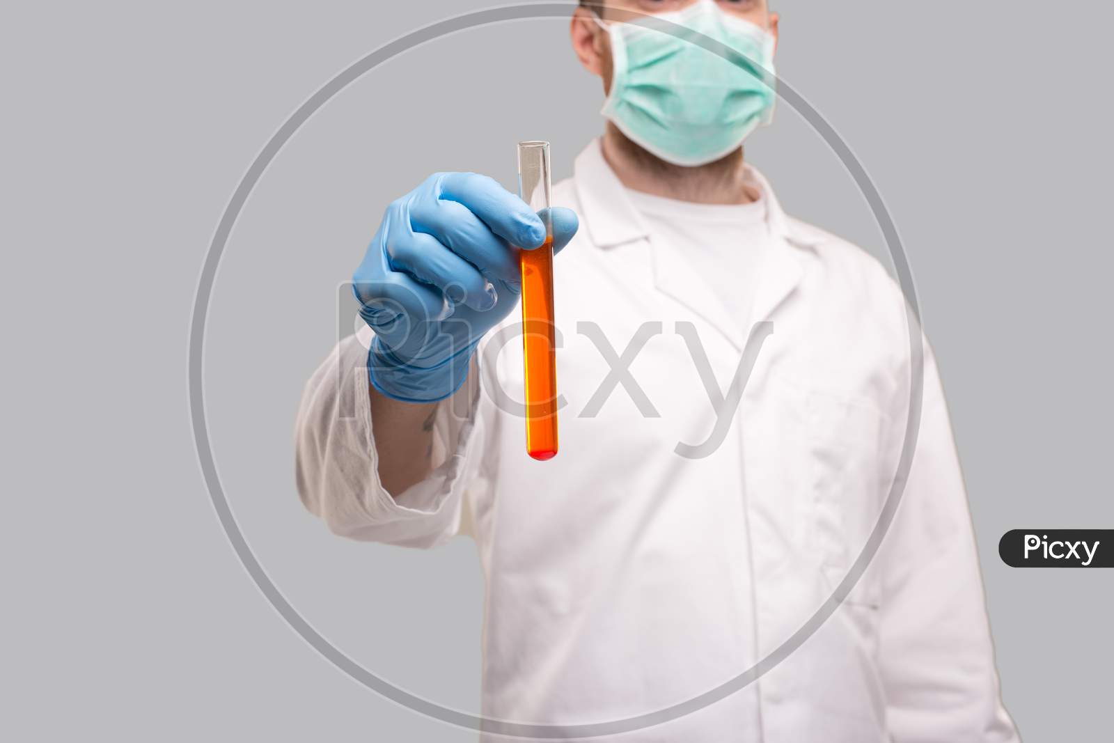Doctor Showing Blood Analysis Wearing Gloves And Medical Mask. Blood Analysis Close Up. Red Liquid